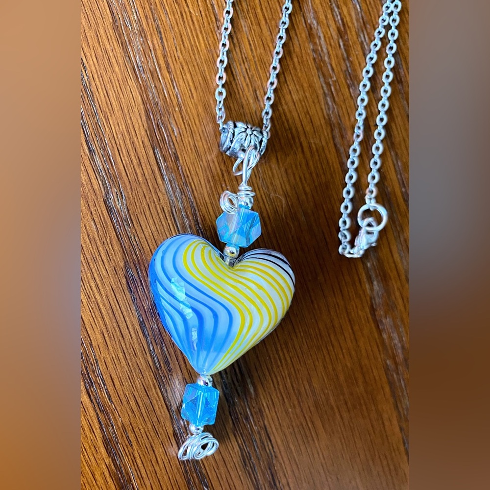 Blue and yellow swirl glass heart and crystal beaded pendant necklace